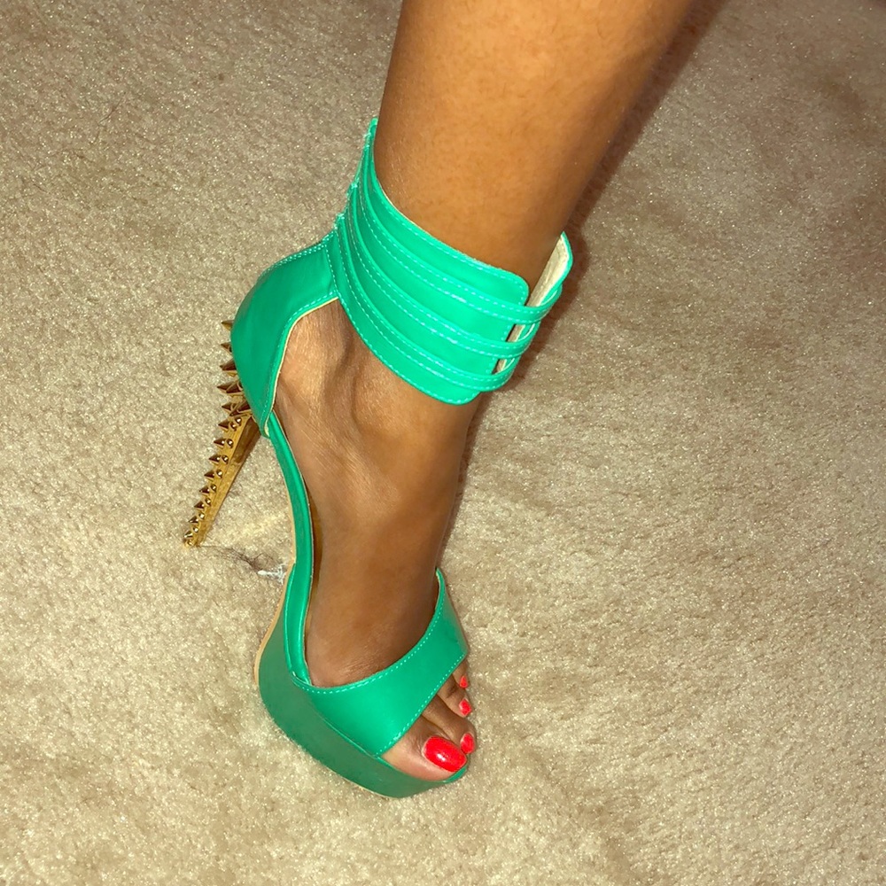 Pretty green gold studded heels.